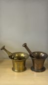 Two apothecary mortars (one brass, one bronze) with pestles