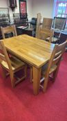 Extendable oak dining table with four chairs