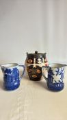Pair of Royal Doulton Willow pattern cream jugs and an Imari palette biscuit barrel