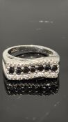9ct White Gold ring set with diamond & dark gem st