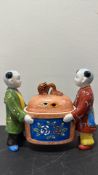 Porcelain figural covered pot with two boys and dragon-finial lid