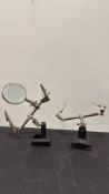 Pair of adjustable helping-hand soldering clamps, one with magnifier