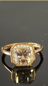 9ct Gold ring set with possible cittrine surrounde