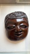 Carved wooden face mask