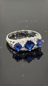 9ct Gold ring set with blue & white stones Weight