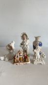 Group of decorative ceramic figurines and vase