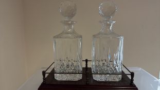 Pair of cut crystal decanters in wooden stand