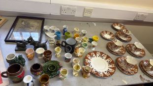 Collection of Wellington China tea trios, novelty egg cups, bronze Scottie dogs and framed print