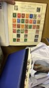 Stamp album together with loose stamps