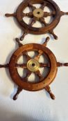 Pair of teak and brass shipâ€™s wheels