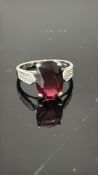 9ct White Gold ring set with oval red stone Weight