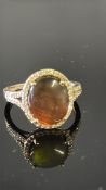 9ct Gold ring set with possible mood stone surroun