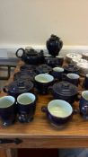Collection of dark blue stoneware service and floral dessert plates