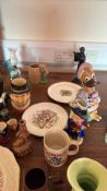 Collection of assorted ceramic character jugs, commemorative plates and novelty mugs