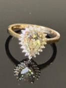 9ct Gold ring central possible citrine surrounded