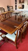 Mahogany twin-pedestal dining table with two additional leaves, together with a set of eight