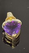 9ct Gold pendant set with amethyst & diamond Weigh