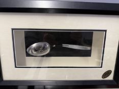 Uri Geller signed bent spoon presented in a shadow