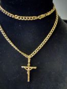 9ct gold curb chain suspended with a 9ct gold cros