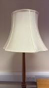 Wooden floor lamp with cream fabric shade