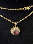 9ct gold pendant suspended on a 9ct gold Figaro ch