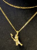 9ct gold witch pendant suspended on a 9ct gold cha