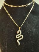 9ct gold snake pendant set with white gemstones su