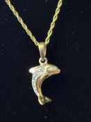 9ct gold dolphin pendant suspended on a 9ct gold rope