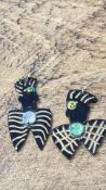 Pair of stylised wooden figure earrings
