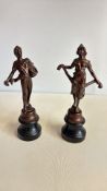 Pair of bronzed rural harvest figures on ebonised plinths