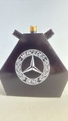Black Mercedes Benz oil can