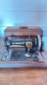 Jones “Family C.S.” hand-crank sewing machine with wooden case