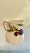 Hand-painted tubelined fruit-decorated cream jug