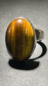 Large silver ring set with tigers eye