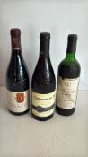 Three French red wine bottles