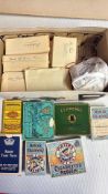 Box of cigarette cards and vintage cigarette tins