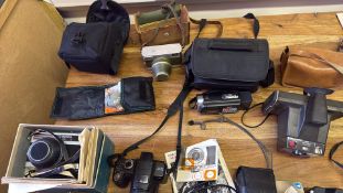 Collection of vintage and digital cameras and accessories