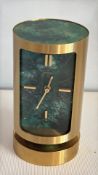 Swiza 8-day brass cylindrical desk alarm clock