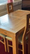 Set comprising rectangular oak dining table with chamfered square legs and four high-back chairs