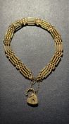 9ct Gold gate bracelet with heart shaped locket &