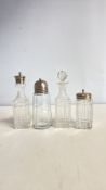 Set of four moulded glass condiment bottles: two square-section cruets with brass screw tops, a