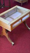 Rectangular oak bijouterie with glazed hinged top and glazed sides, velvet-lined interior, on twin