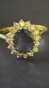 18ct Gold ring set with 16 diamonds surrounding ce