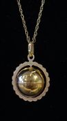 9ct Gold chain set with articulating globe pendant