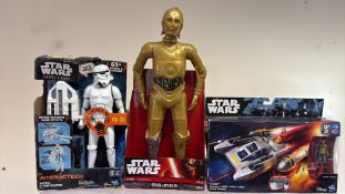Group of Star Wars boxed action figures and vehicle