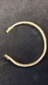 9ct gold tennis bracelet set with white gem stones