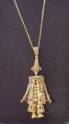 Silver gilt articulating clown pendant set with ge