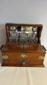 Victorian oak brass-mounted triple decanter tantalus