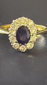 18ct Gold diamond ring with central sapphire & 10