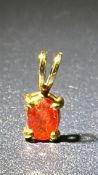 9ct Gold pendant set with red stone